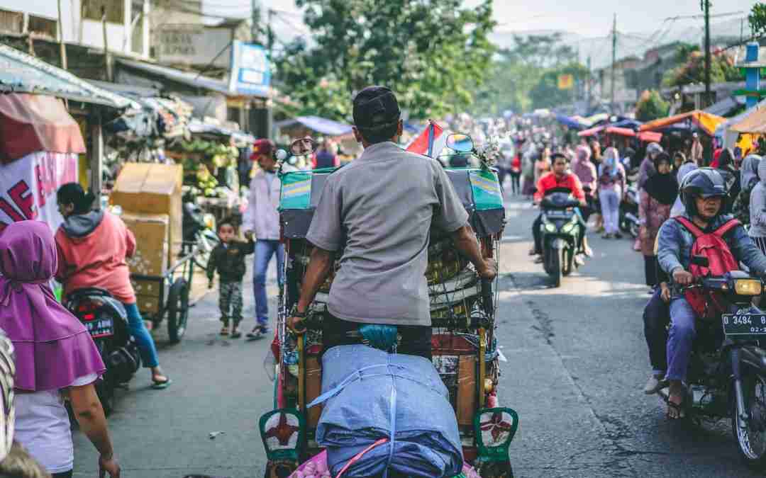 Busy town with consumers on motorbikes